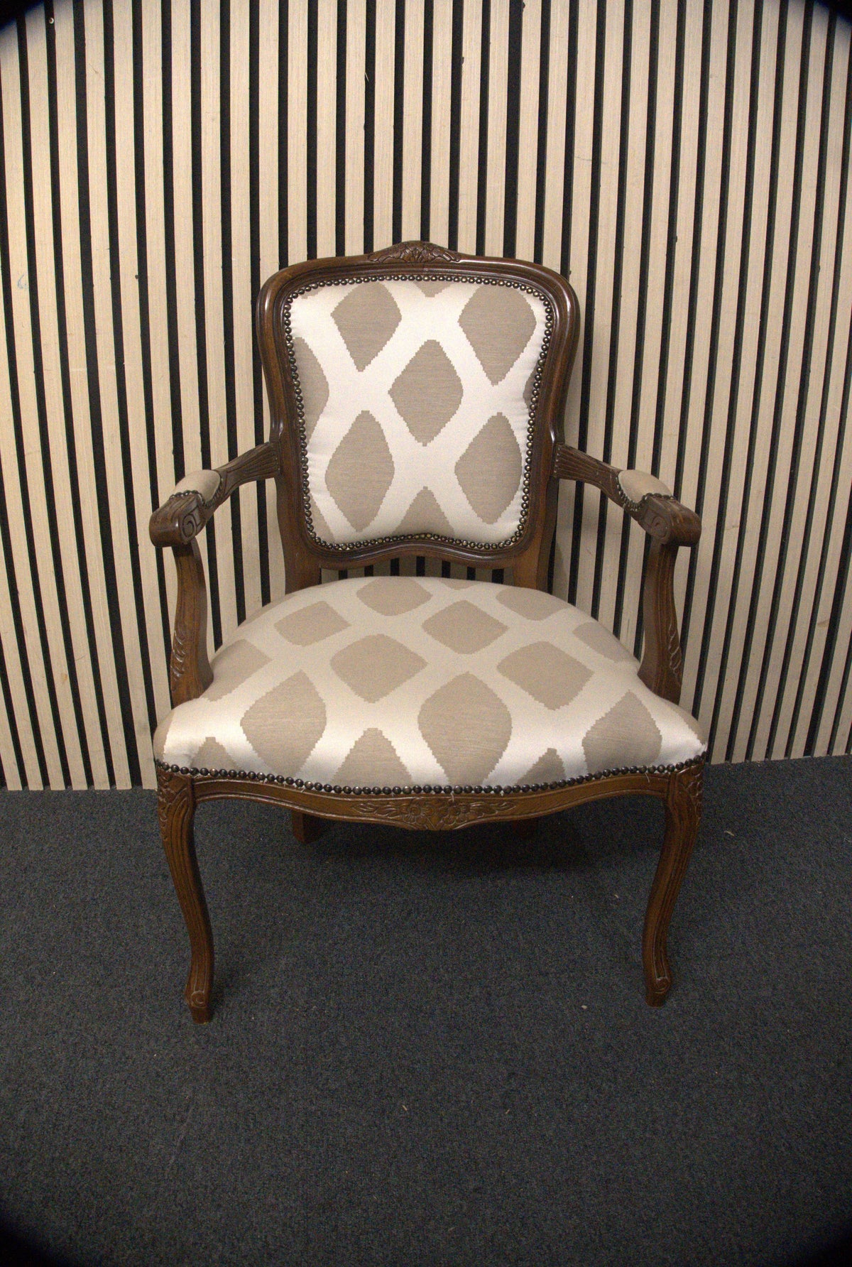 Solid mahogany Limogue chair with cream fabric pattern and stud details   44340