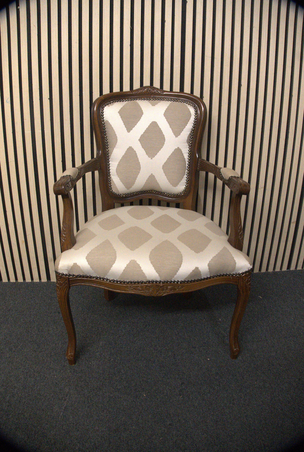 Solid mahogany Limogue chair with cream fabric pattern and stud details   44340