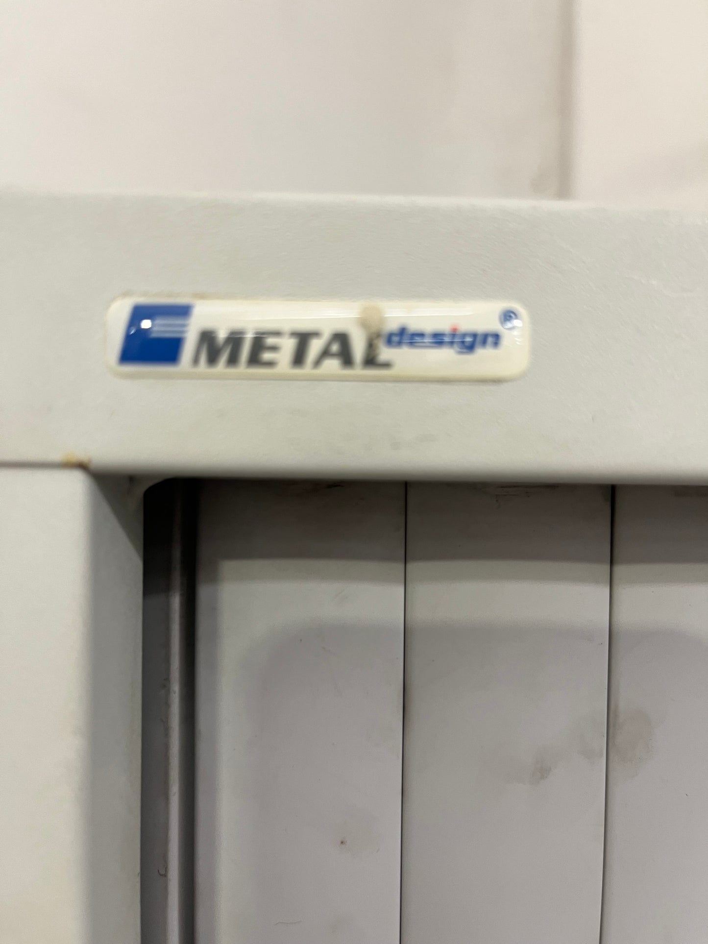 Tall 2 door sideopen metal tambour unit, grey metal frame with grey plastic sliding doors with internal shelves 190Hx100x450D 1425