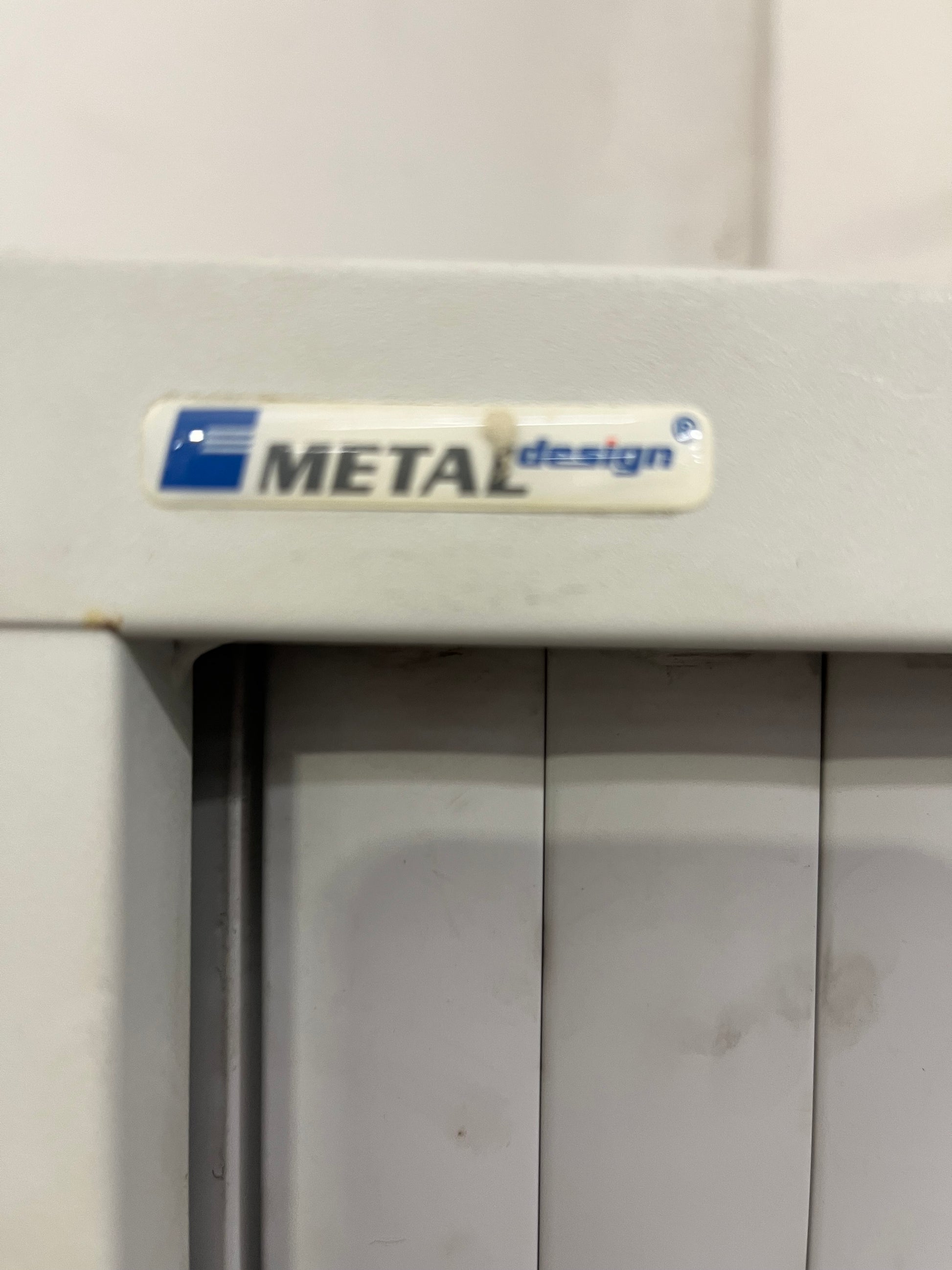 Tall 2 door sideopen metal tambour unit, grey metal frame with grey plastic sliding doors with internal shelves 190Hx100x450D 1425