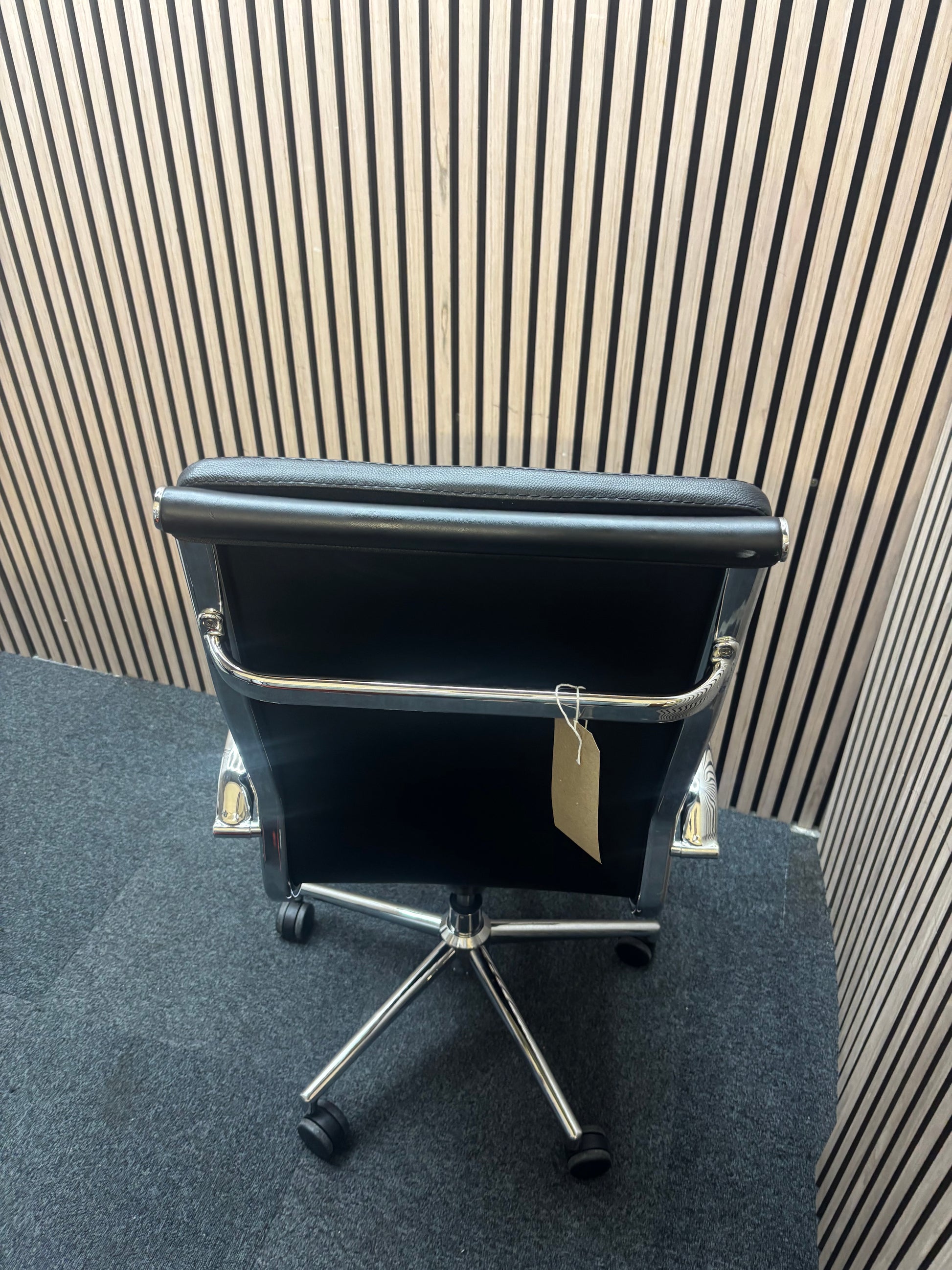 High back real black leather Eames style tall executive height adjustable swivel chair with polished chrome arms and base  J3912