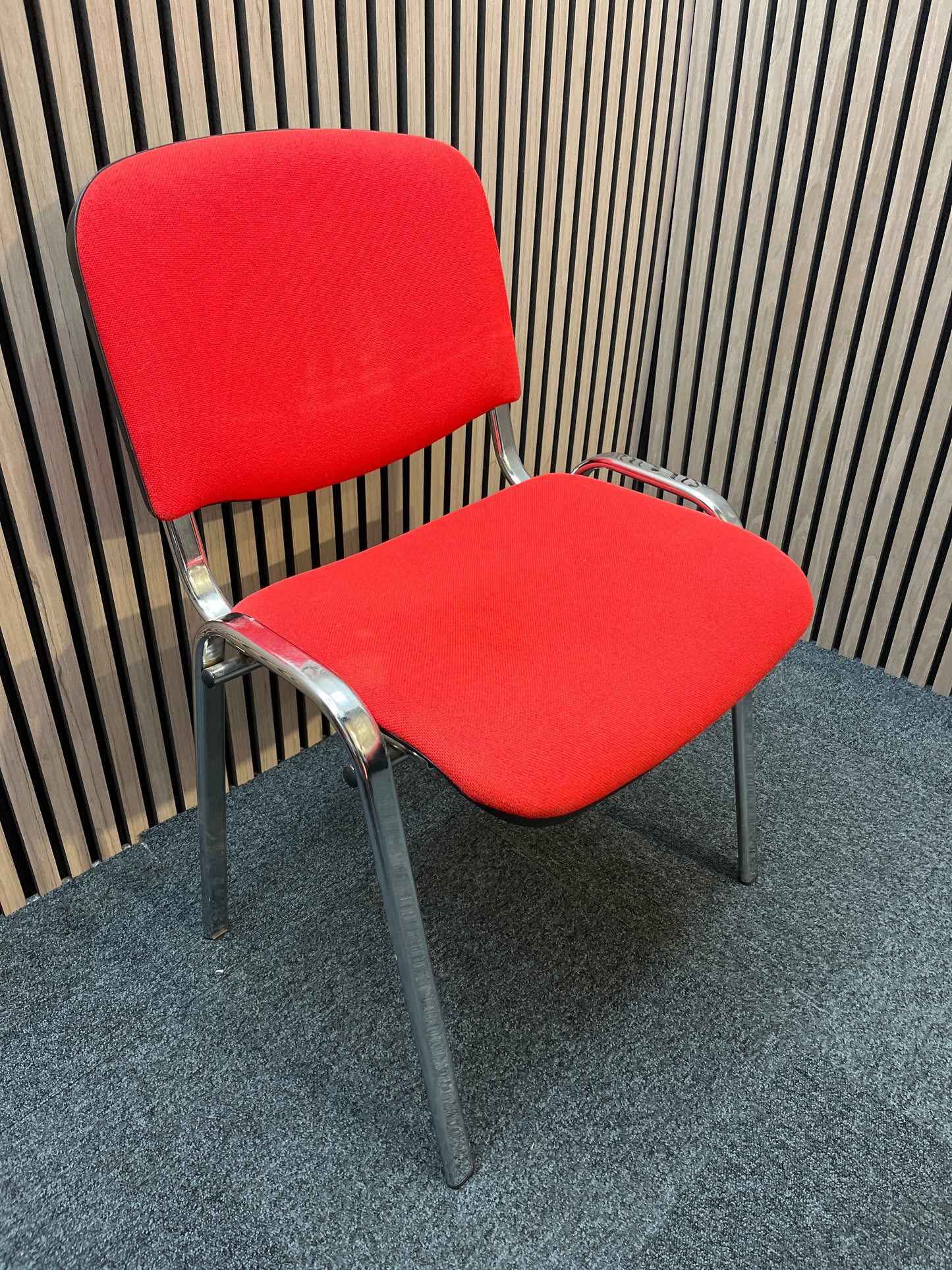 Red fabric stacking conference chair with chrome frame
