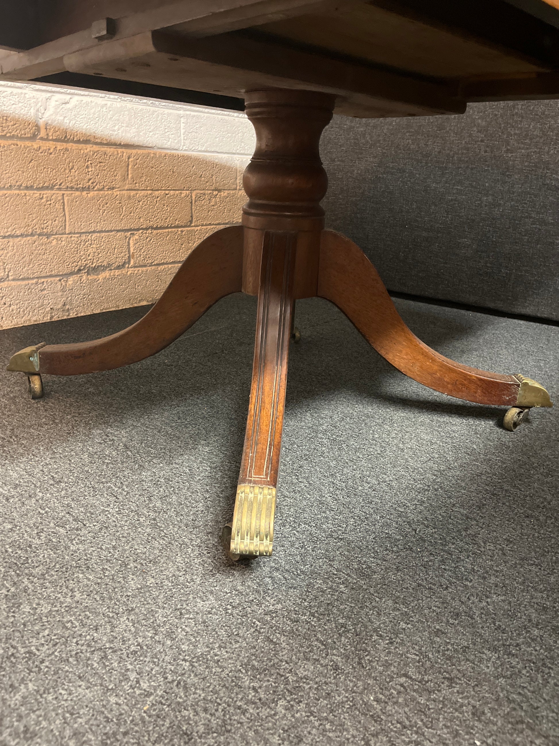 Mahogany stained ornate drop leaf dining table on castors W1270xL1250xH730 3225
