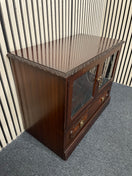 Dark wood TV unit with leaded glass doors and drawers.  44509