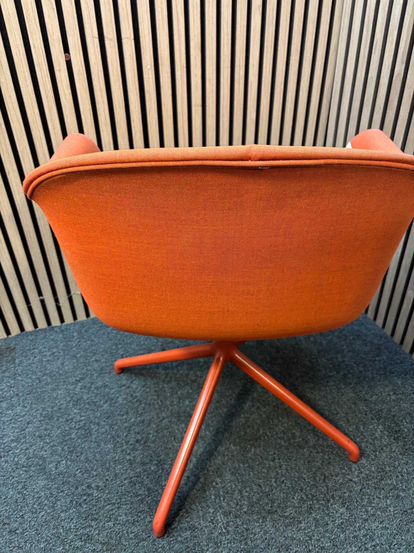 Muuto fibre armchair with a swivel base in manner 2 fabric with red painted metal spider base   J3911