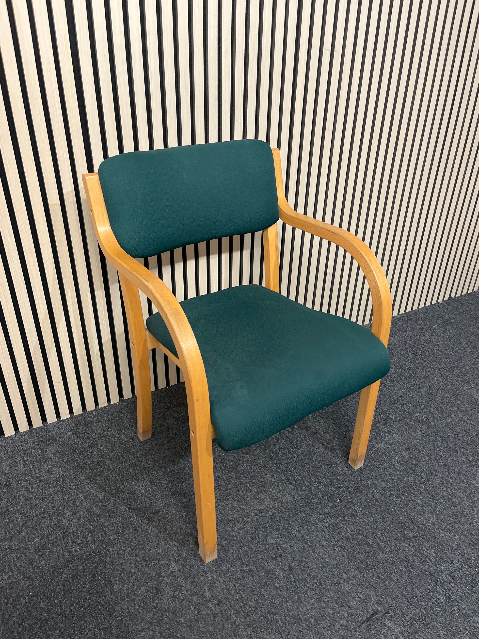 solid beech framed stacking chair with arms, green fabric seat and back