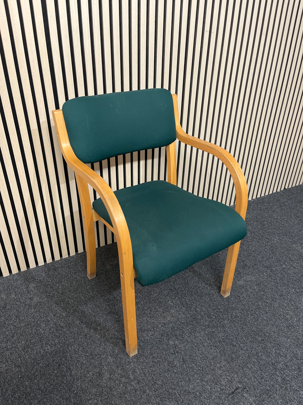 solid beech framed stacking chair with arms, green fabric seat and back
