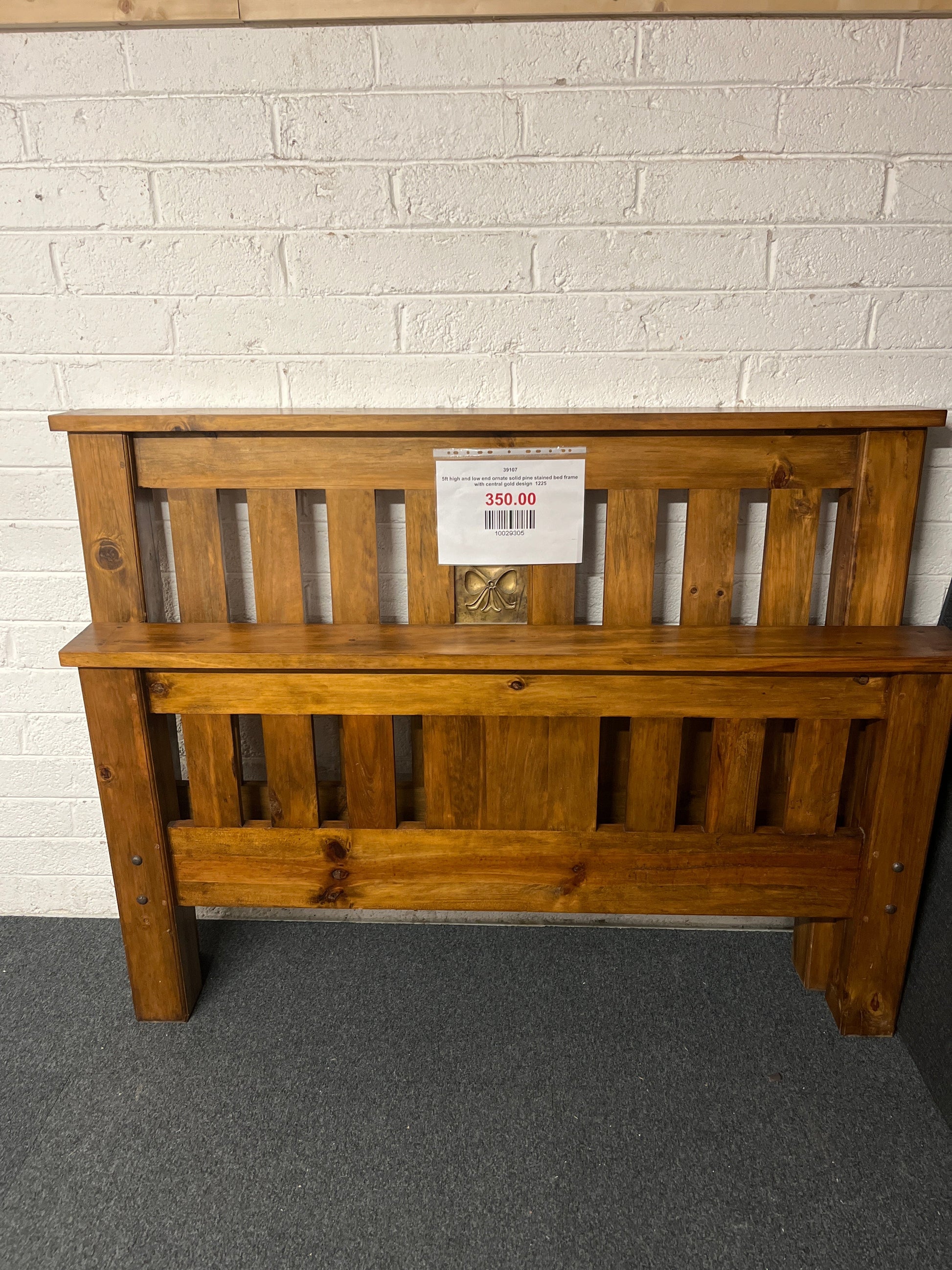 5ft high and low end ornate solid pine stained bed frame with central gold design  1225