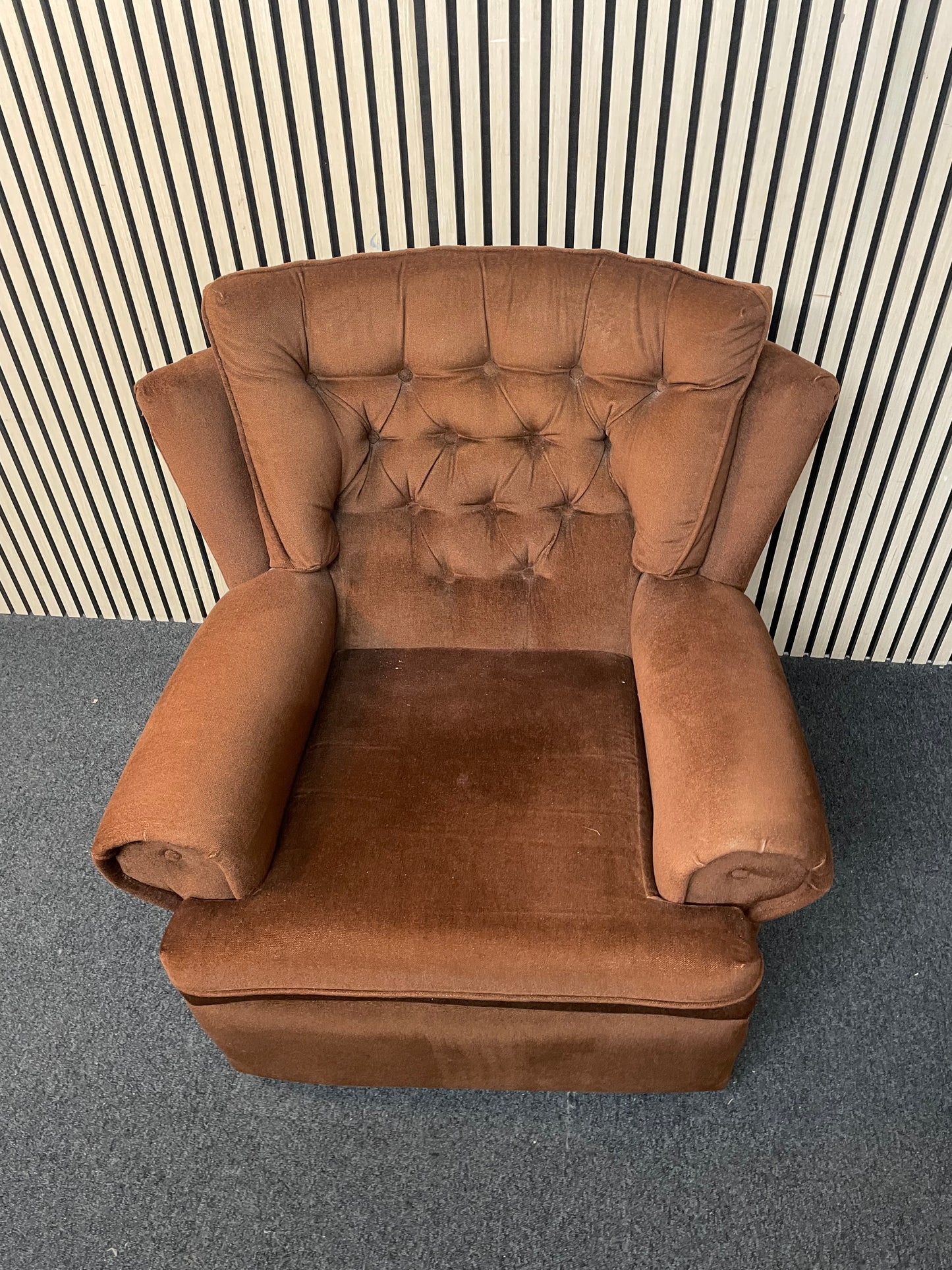 Brown fabric button back fireside armchair on castors 2425
