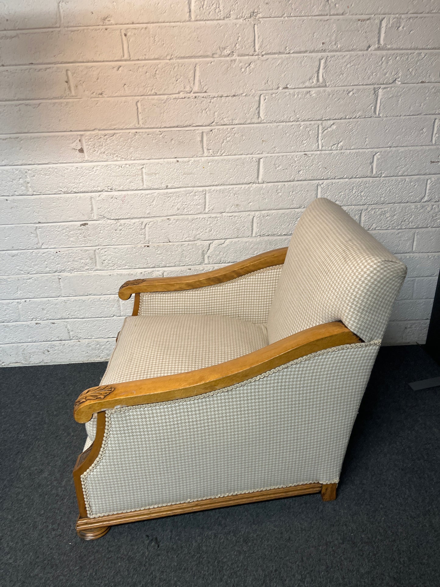 Antique solid oak framed ornate carved detail wing back armchair with  cream chequered fabric 2225
