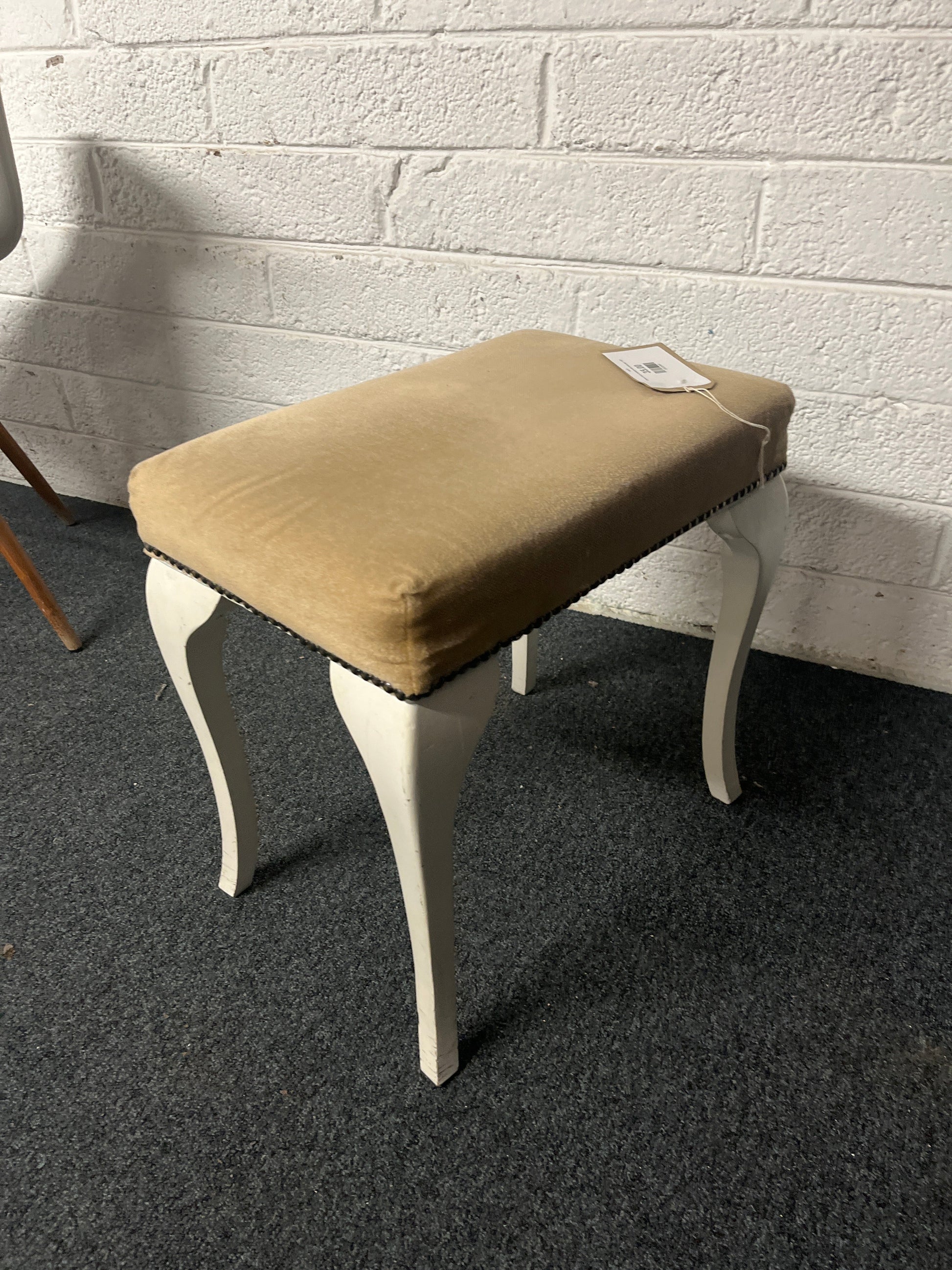 Brown fabric footstool with white legs  1225