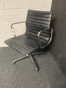 Switch Eames style black leather low back swivel chair with polished chrome base on pads or castors 3 image