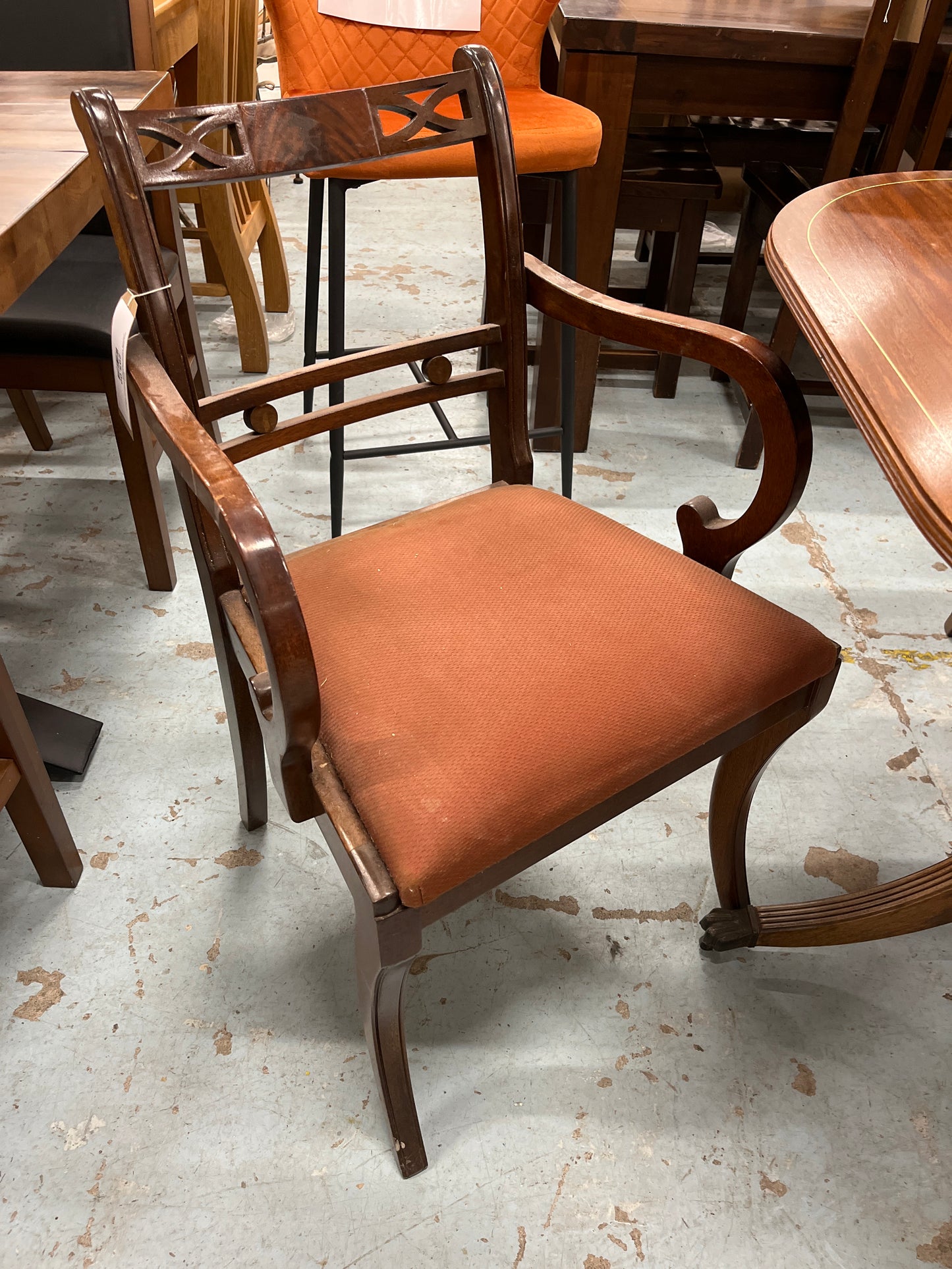 Oval shaped mahogany extendable table on castors with matching  2 carver and 4 dining chairs with red fabric seat 2125