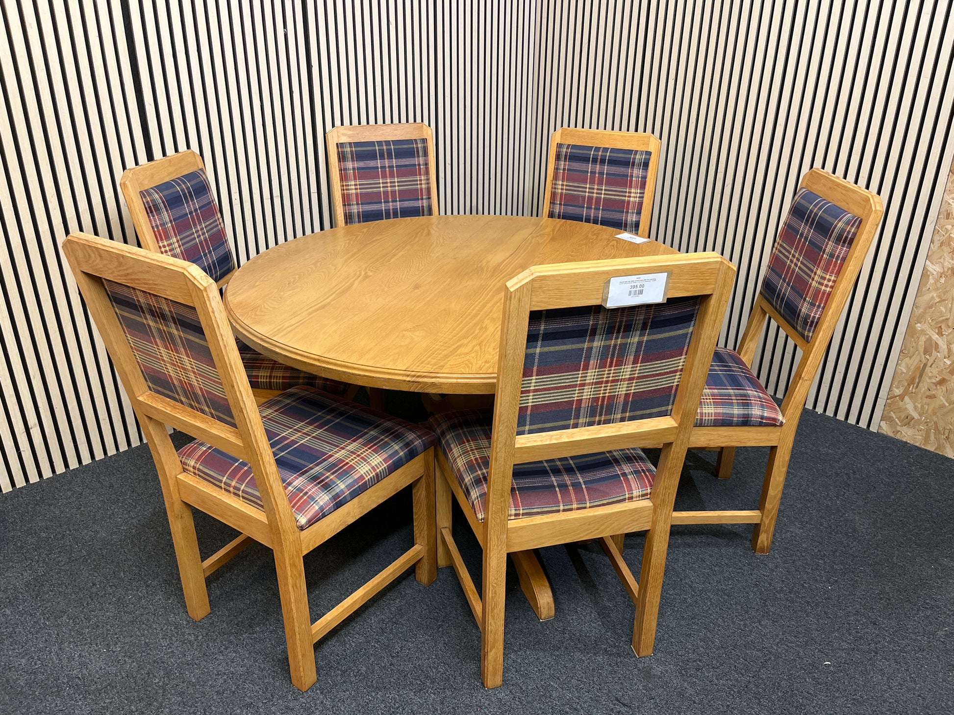 Round light oak table central base with five matching tartan upholstered chairs. (135 cm in diameter)  44285