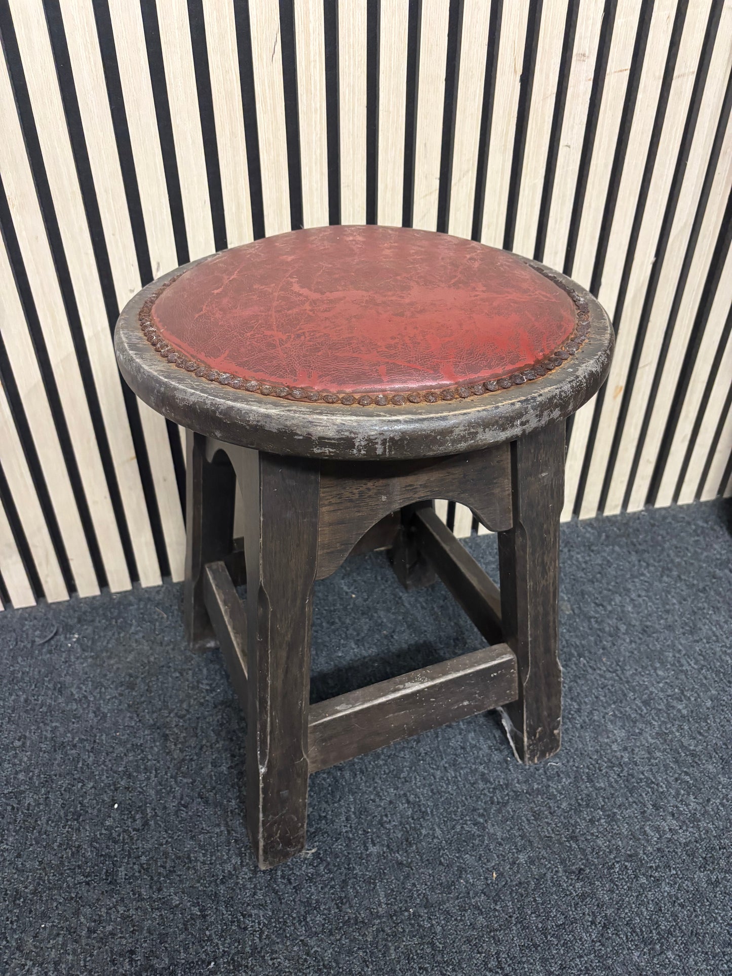 Solid darkwood low pub stool with red leatherette seat and button detailing 43685