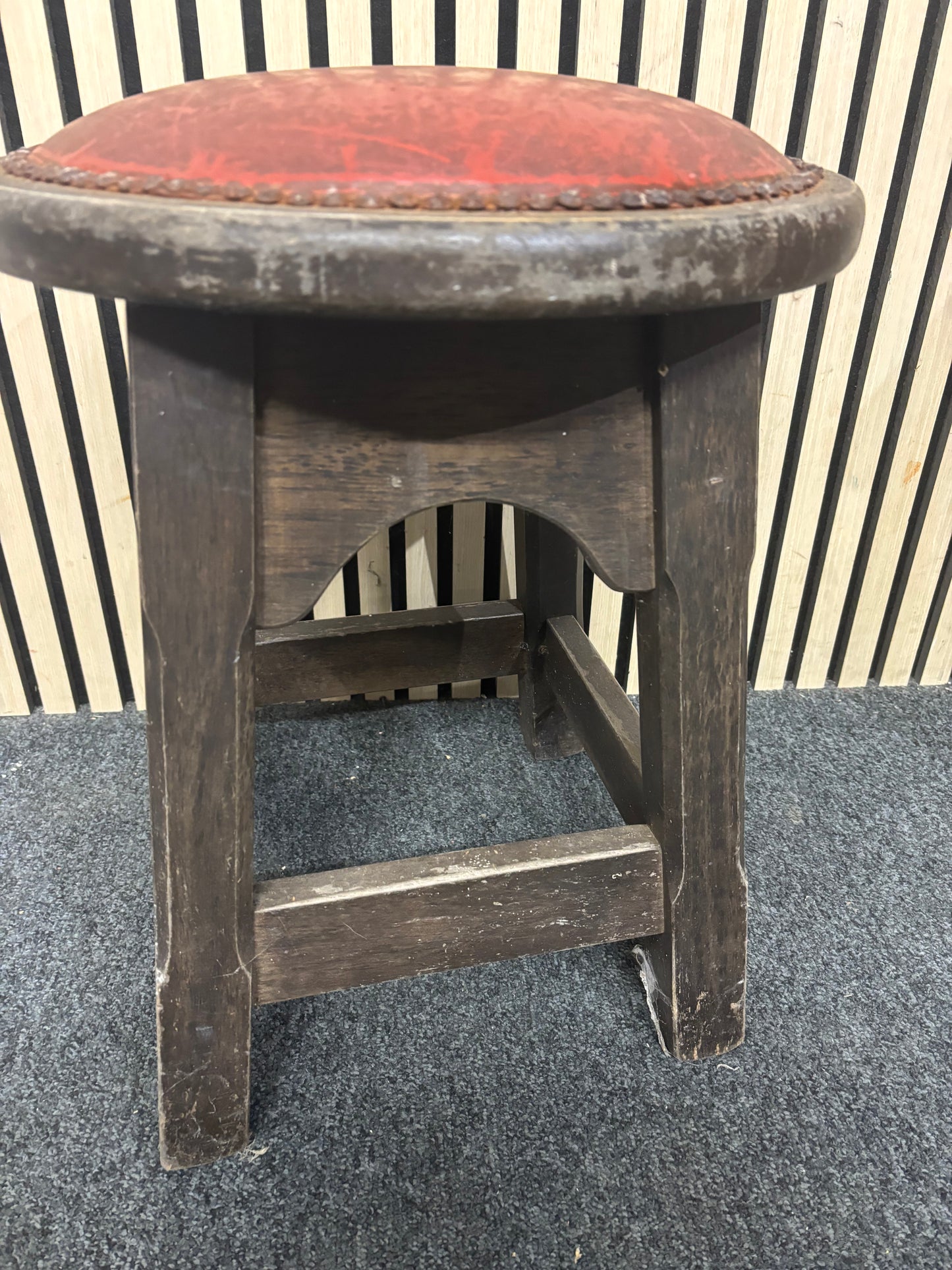 Solid darkwood low pub stool with red leatherette seat and button detailing 43685