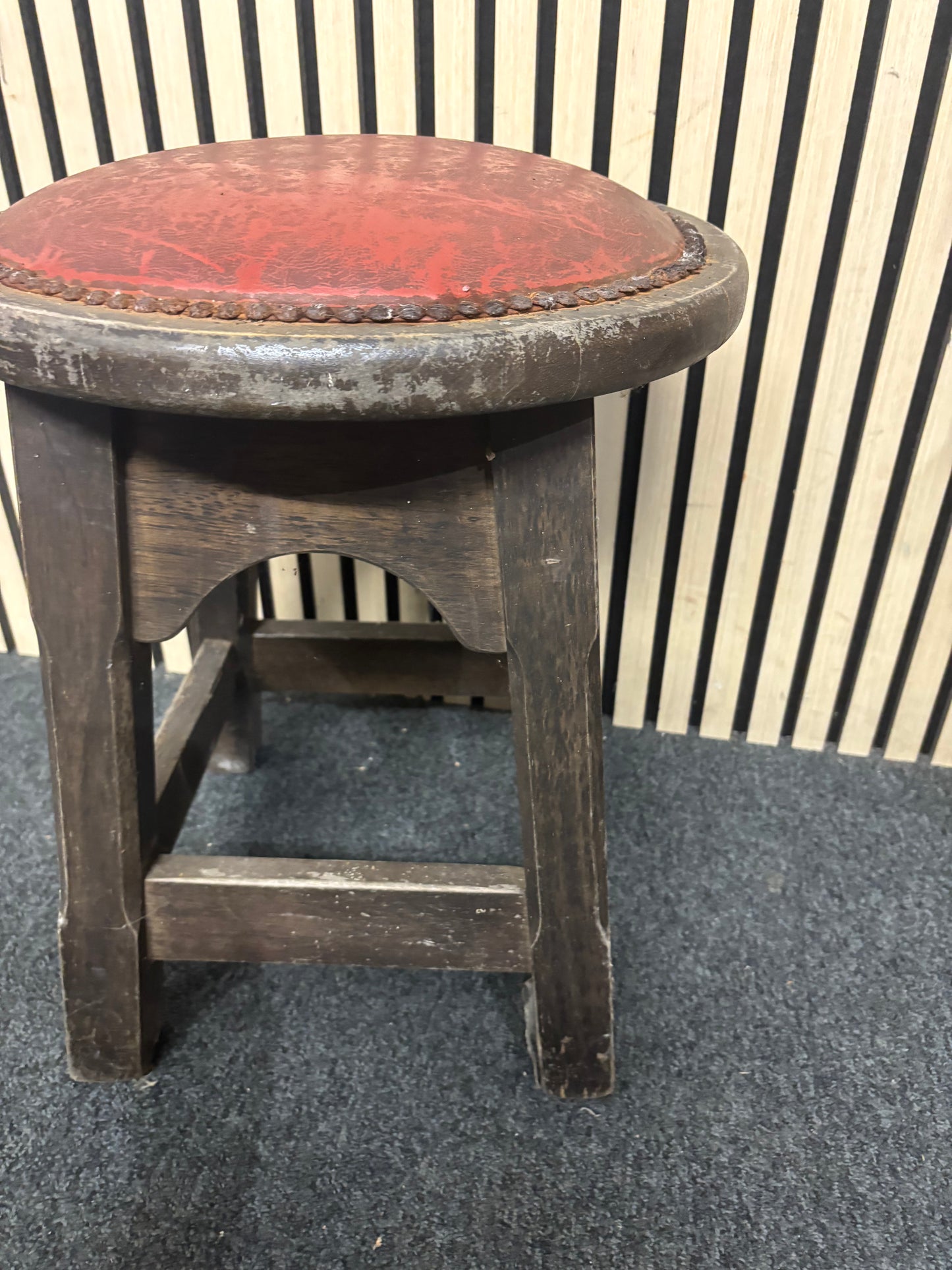 Solid darkwood low pub stool with red leatherette seat and button detailing 43685