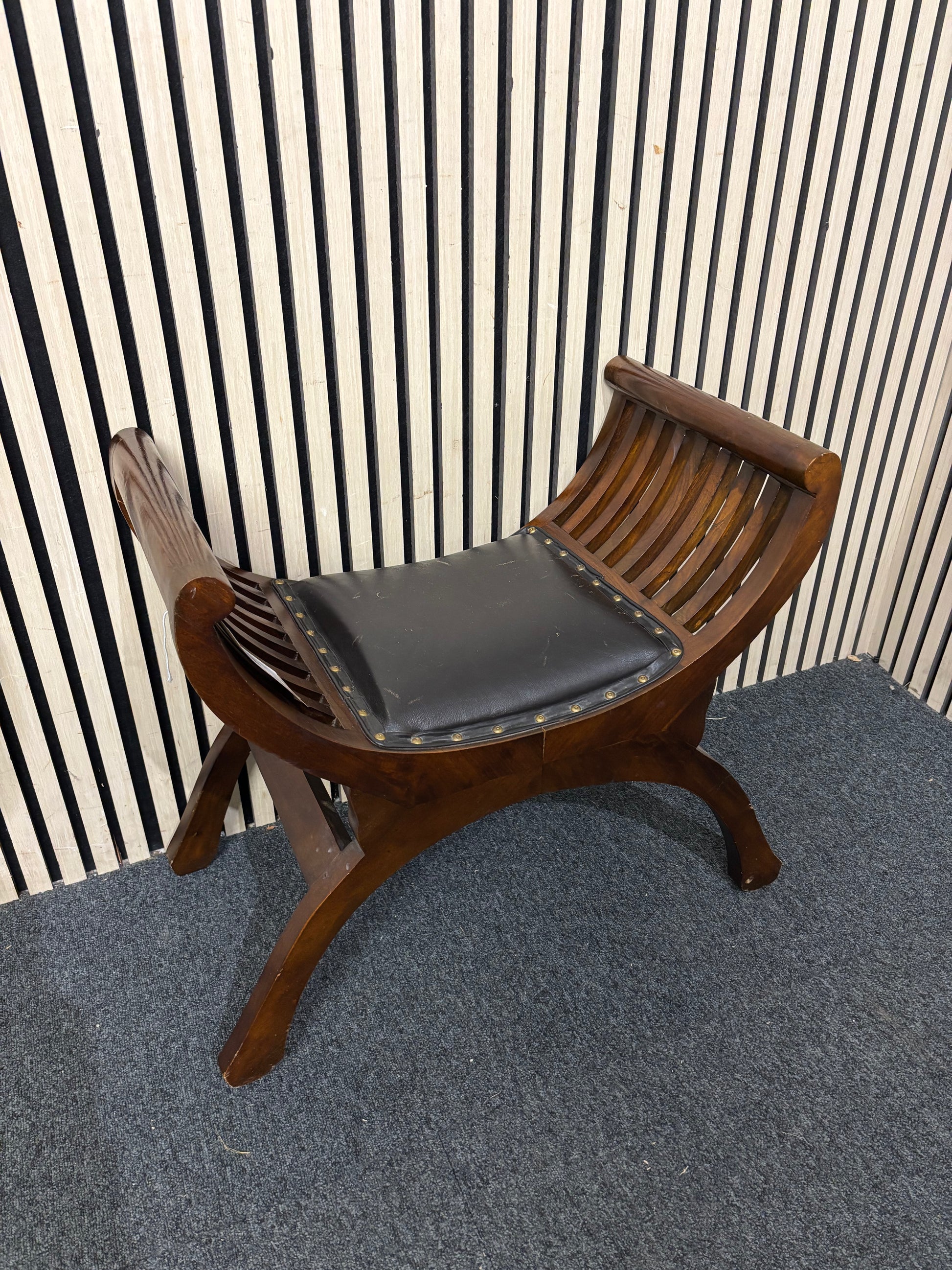 Darkwood curved footstool with leather cushioned seat  44223