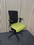 Actiu STAY multifunction swivel office chair with black mesh back and olive green seat fabric with height adjustable arms