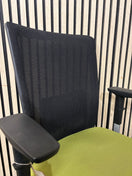 Actiu STAY multifunction swivel office chair with black mesh back and olive green seat fabric with height adjustable arms