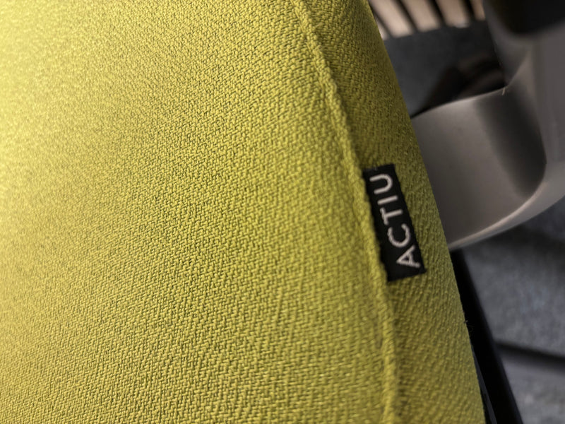 Actiu STAY multifunction swivel office chair with black mesh back and olive green seat fabric with height adjustable arms