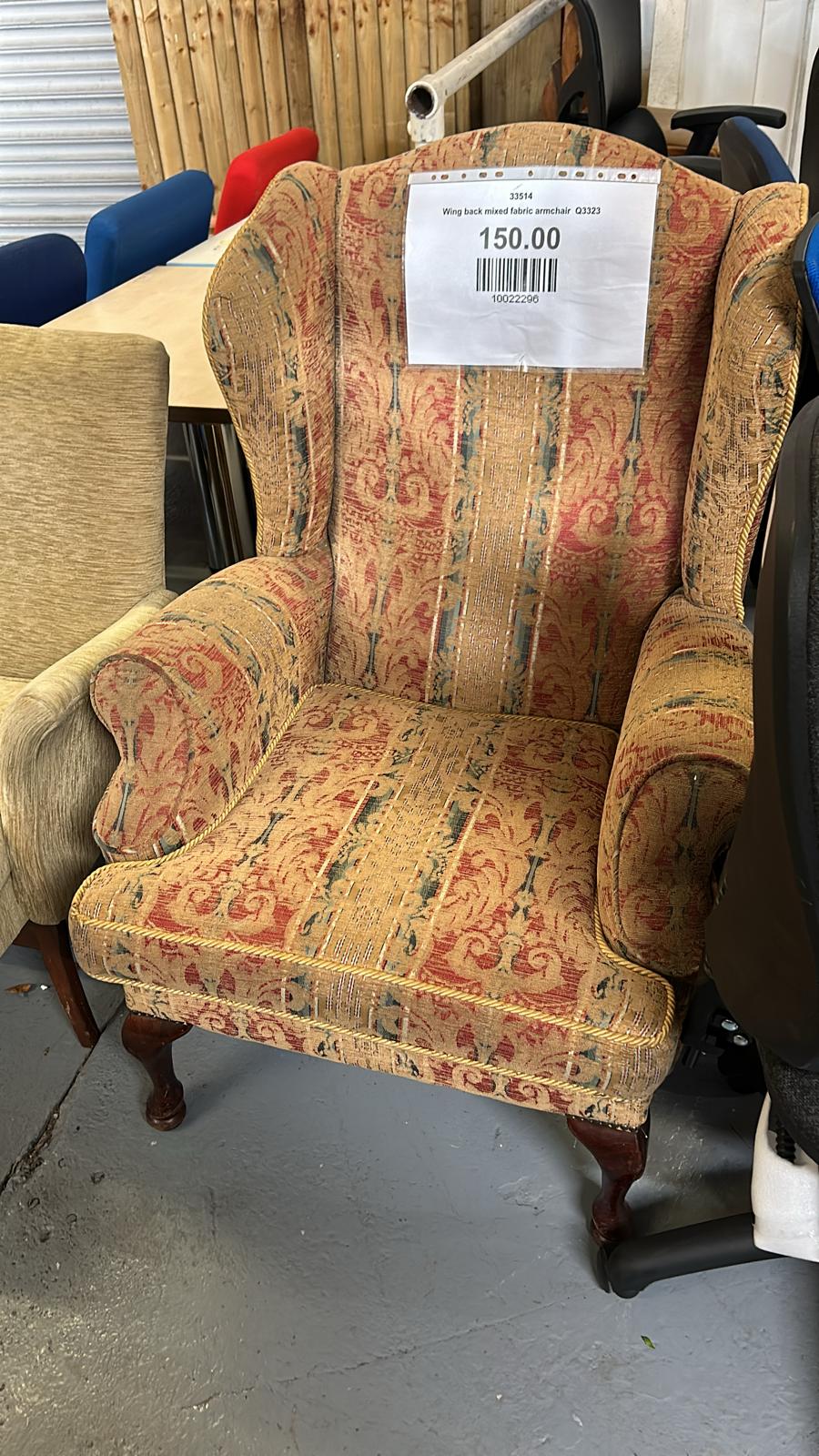 Wing back mixed fabric armchair
