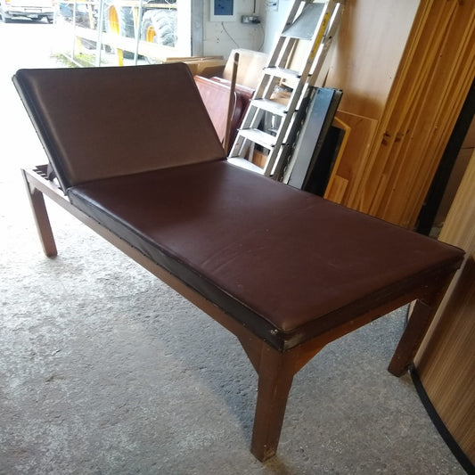 Solid teak framed consultants bench with vinyl covering and adjustable head rest