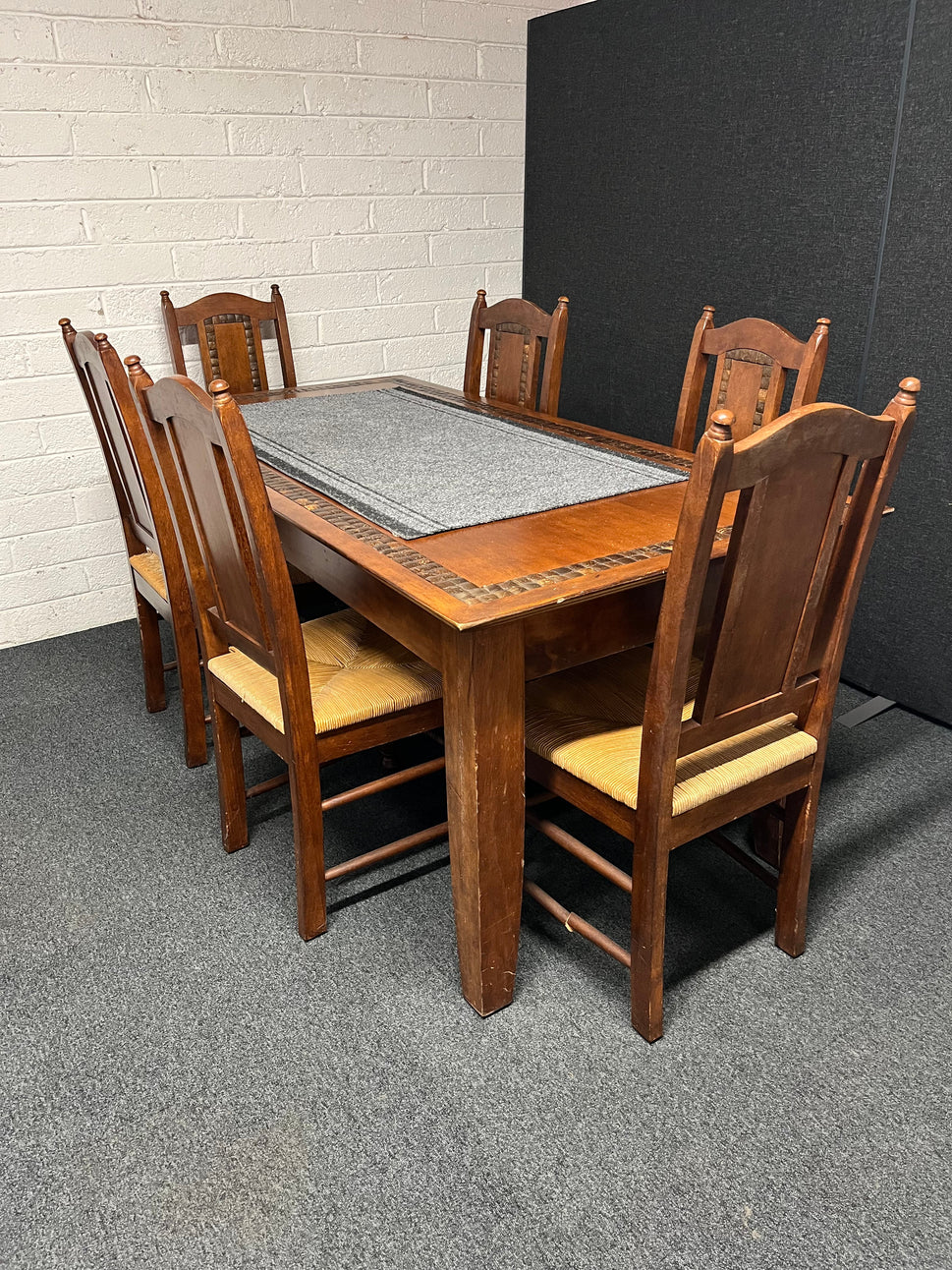 Dark wood stained large kitchen table 90Wx1830L cm with tiled details and 6 no. matching chairs with rattan seat 2225