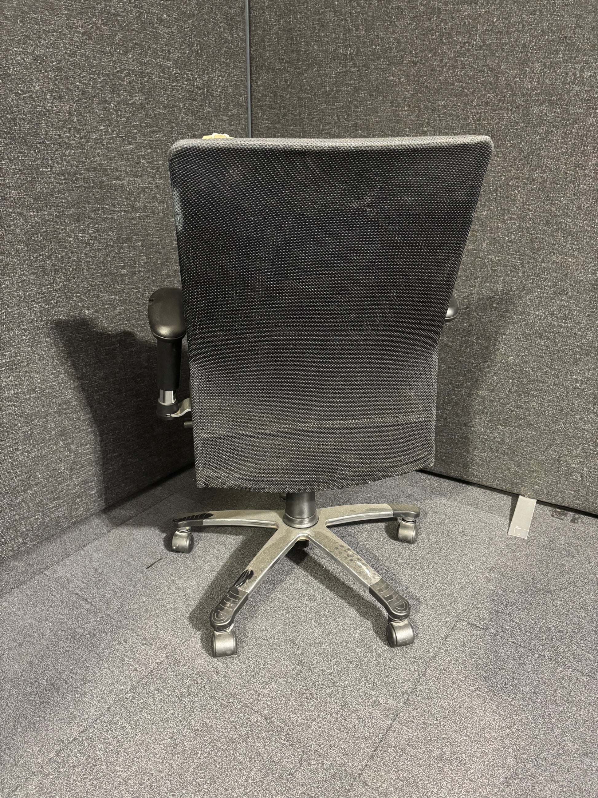 High back black leather and mesh executive swivel chair with polished metal base and height adjustable arms