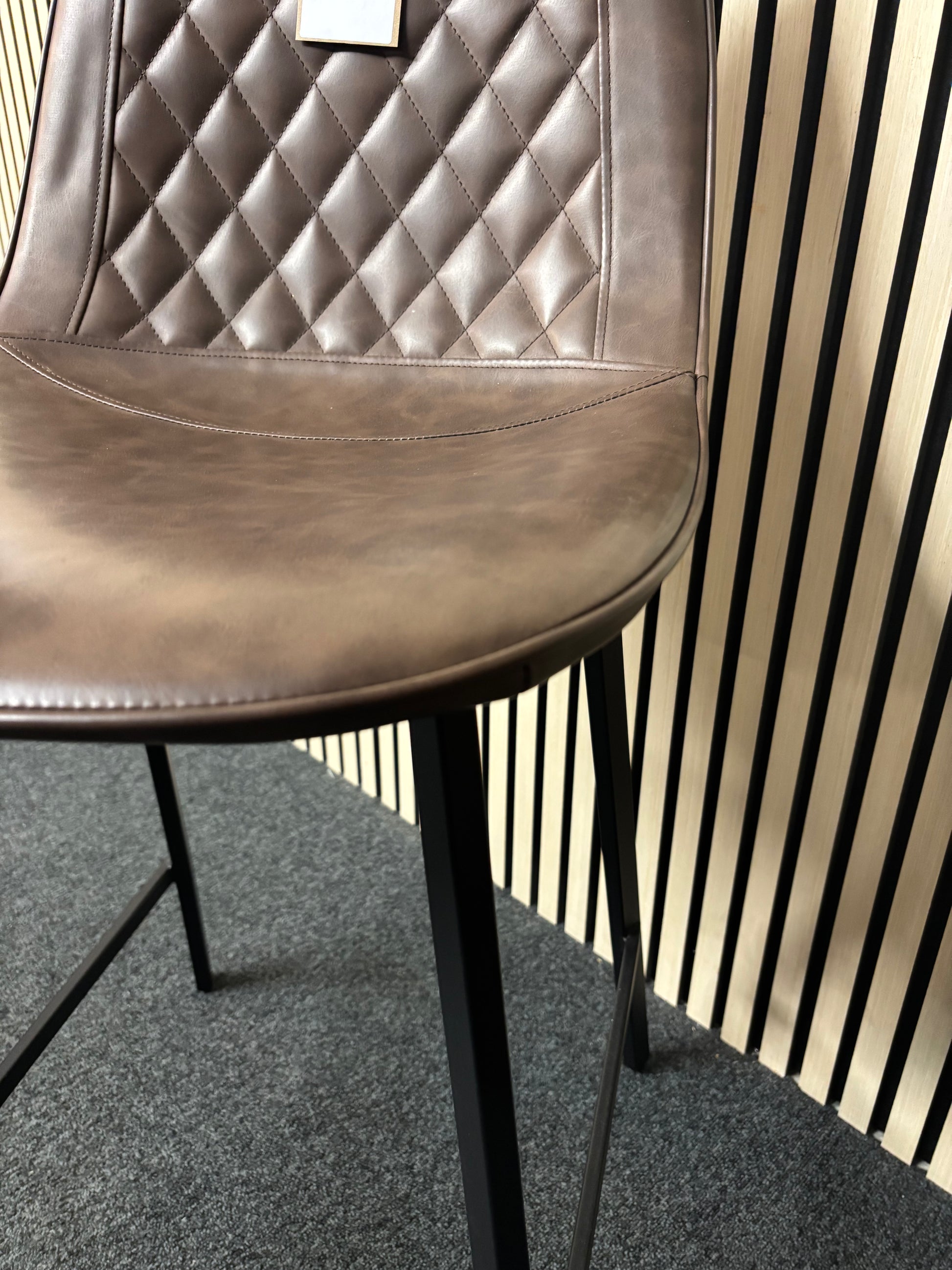 Tall black metal framed bar stool with soft brown leatherette seat 2325