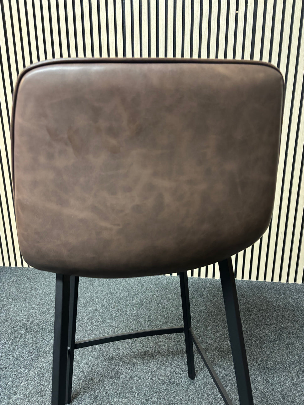 Tall black metal framed bar stool with soft brown leatherette seat 2325