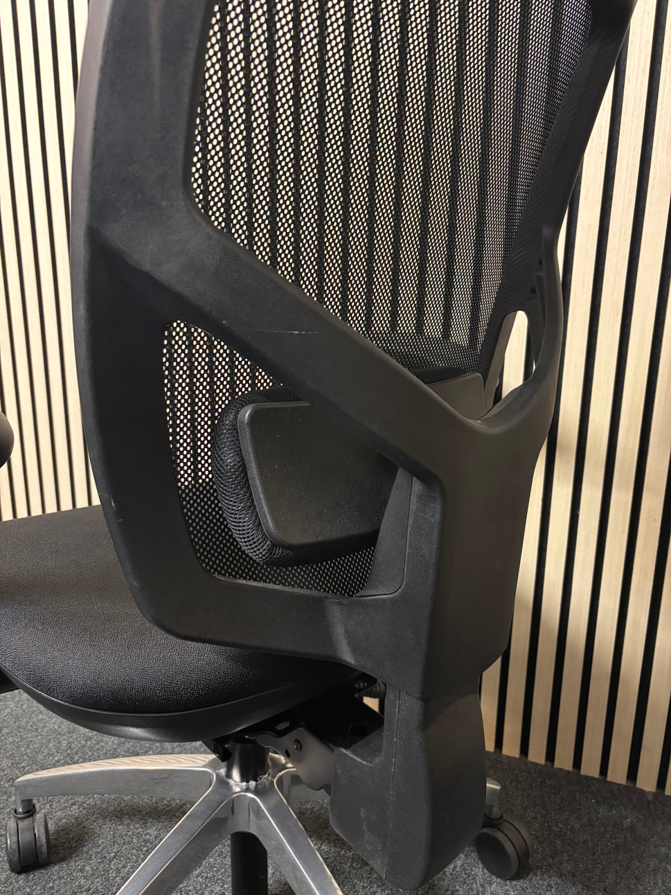 Black mesh back black fabric swivel chair with adjustable arms