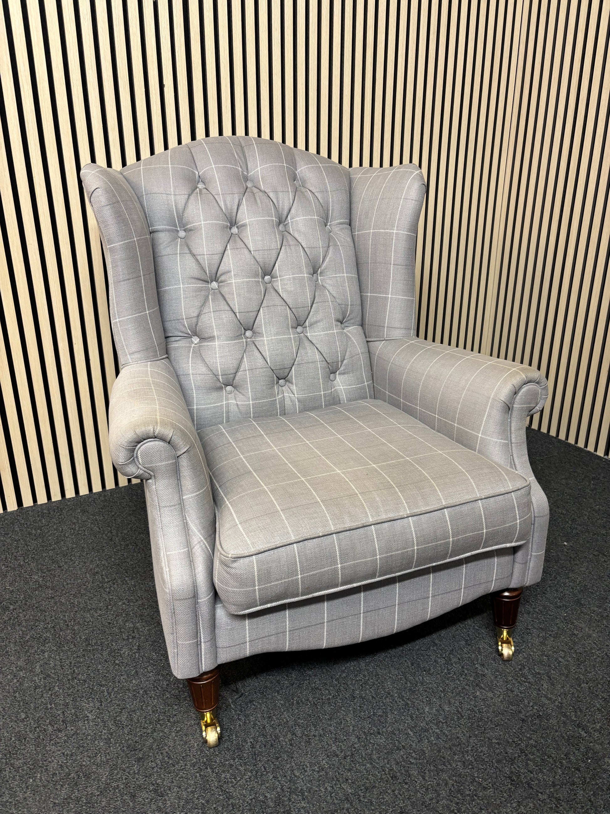 Solid wooden framed grey tartan effect fabric button back armchair on castors 2325