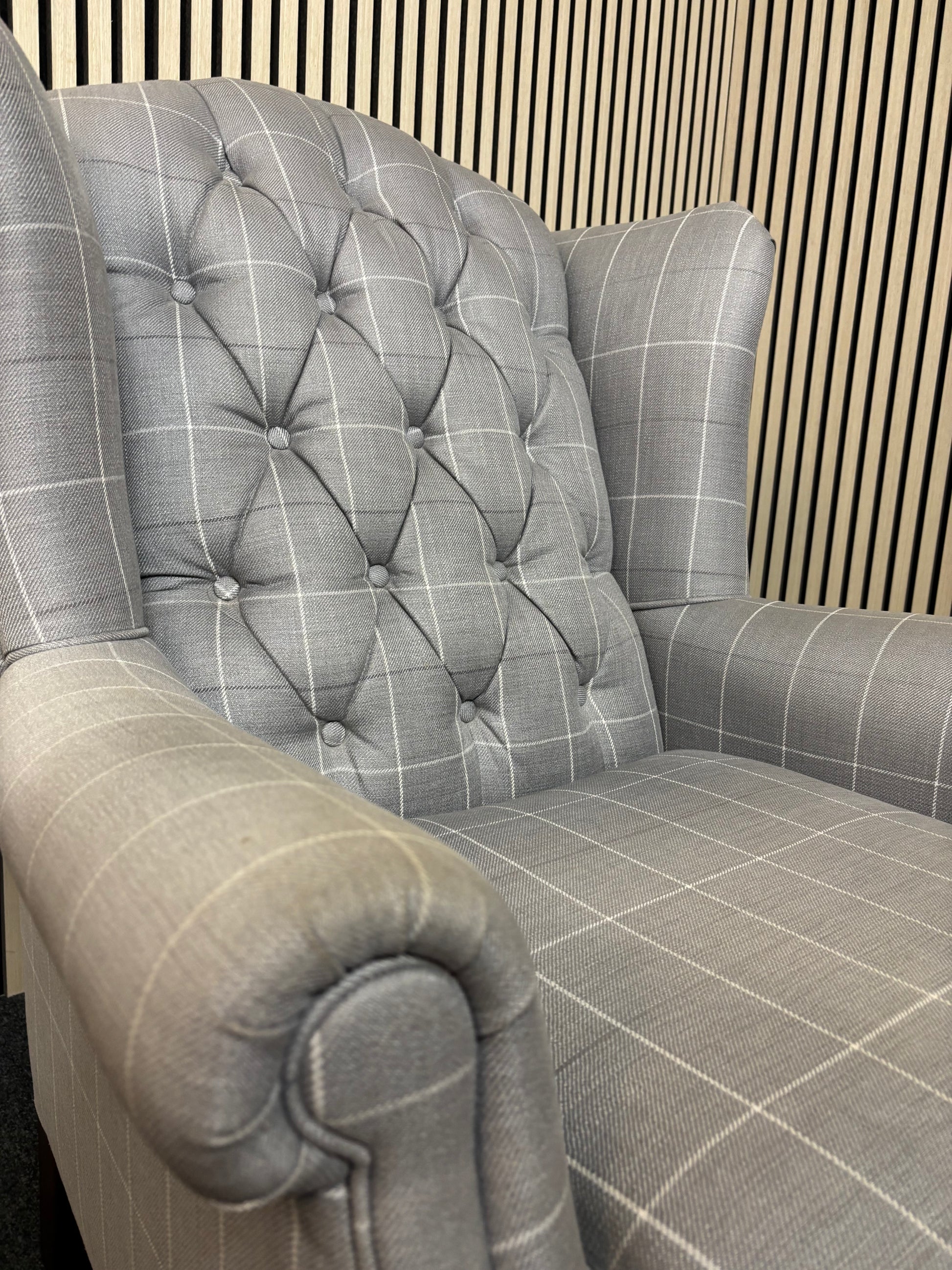 Solid wooden framed grey tartan effect fabric button back armchair on castors 2325