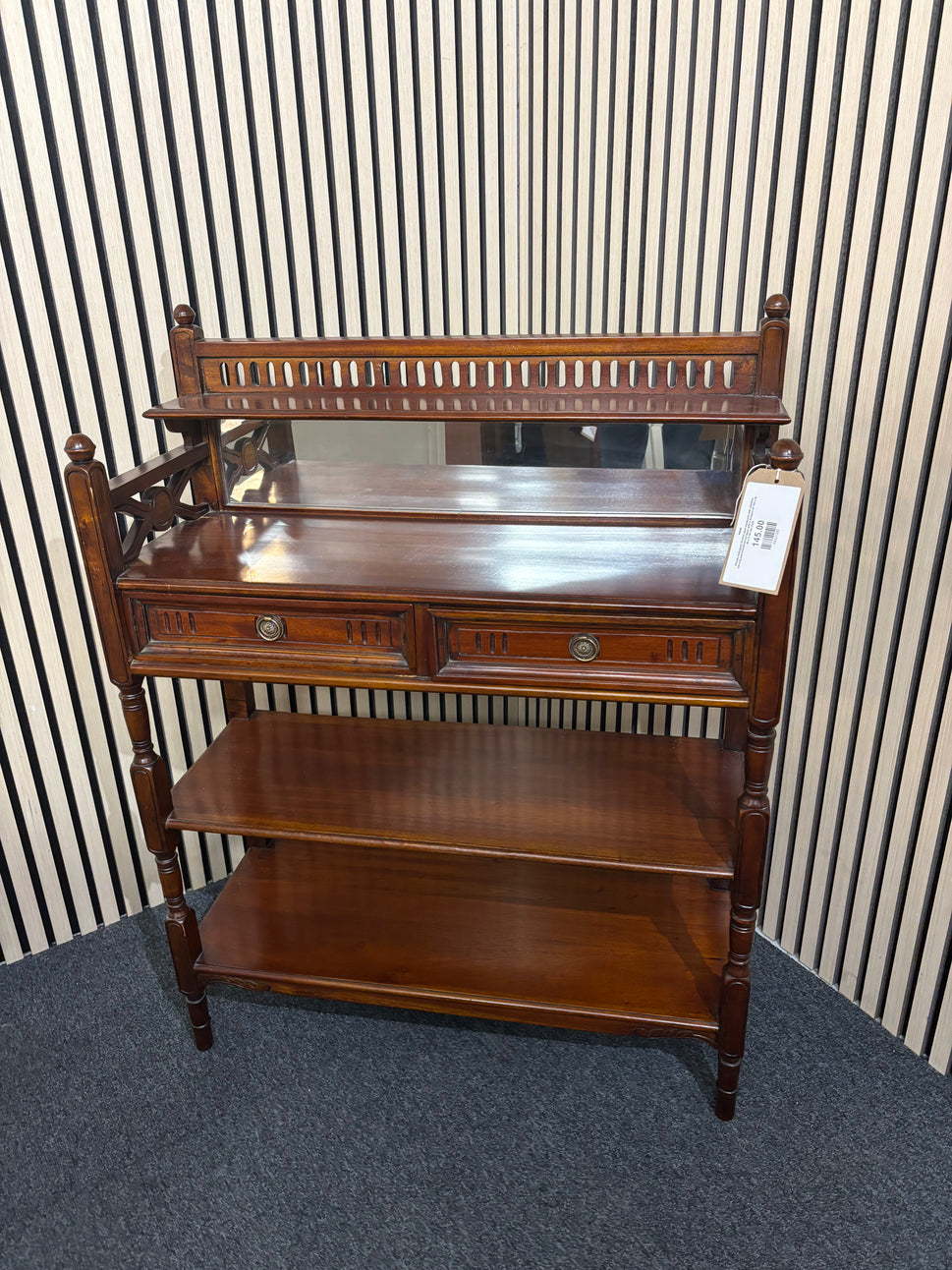 Ornate mahogany framed open bookcase with detailed carving and framed mirror back with 2 drawers (H 105 x W 80 x D 32 cm) 2325