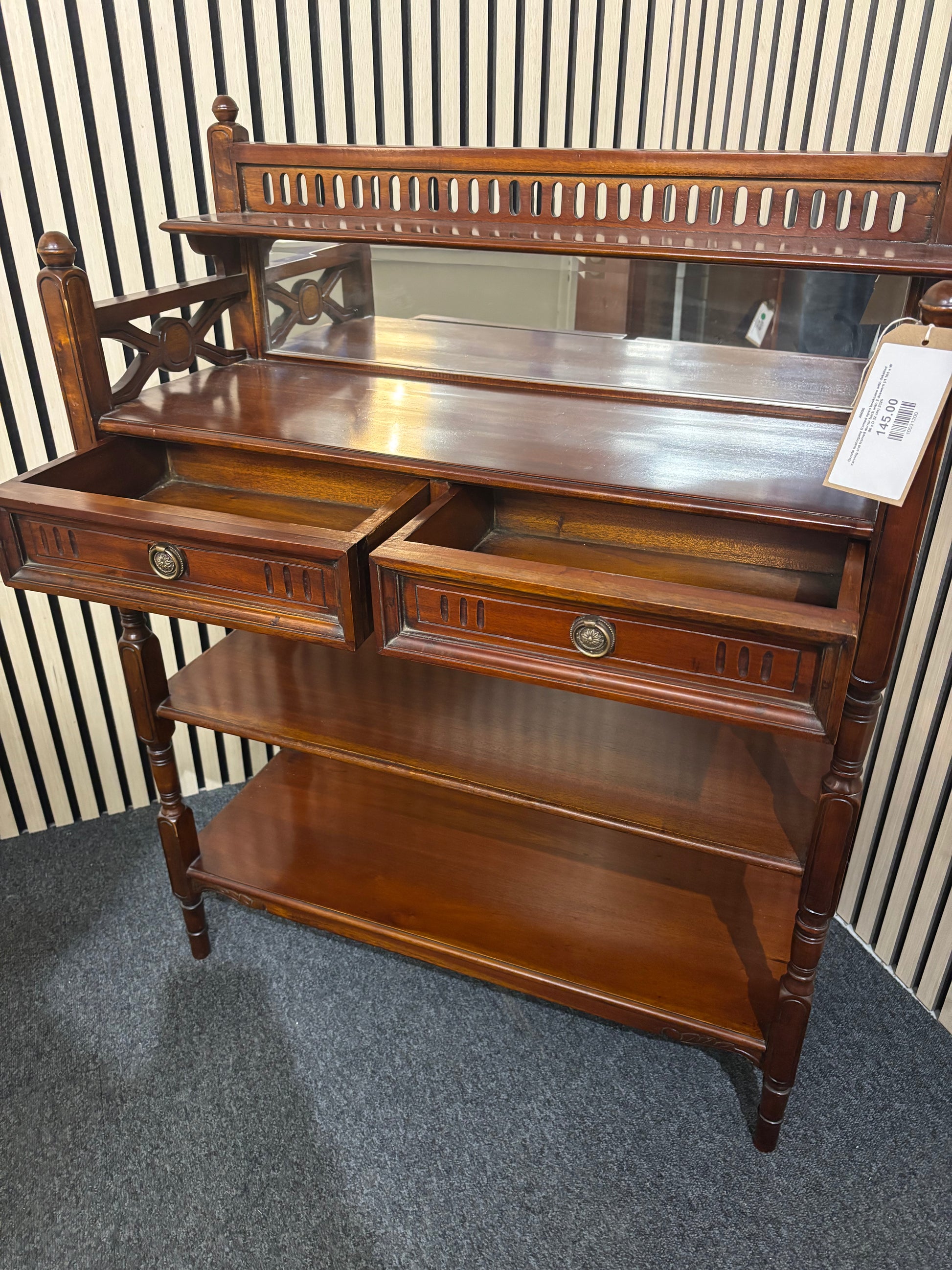 Ornate mahogany framed open bookcase with detailed carving and framed mirror back with 2 drawers (H 105 x W 80 x D 32 cm) 2325