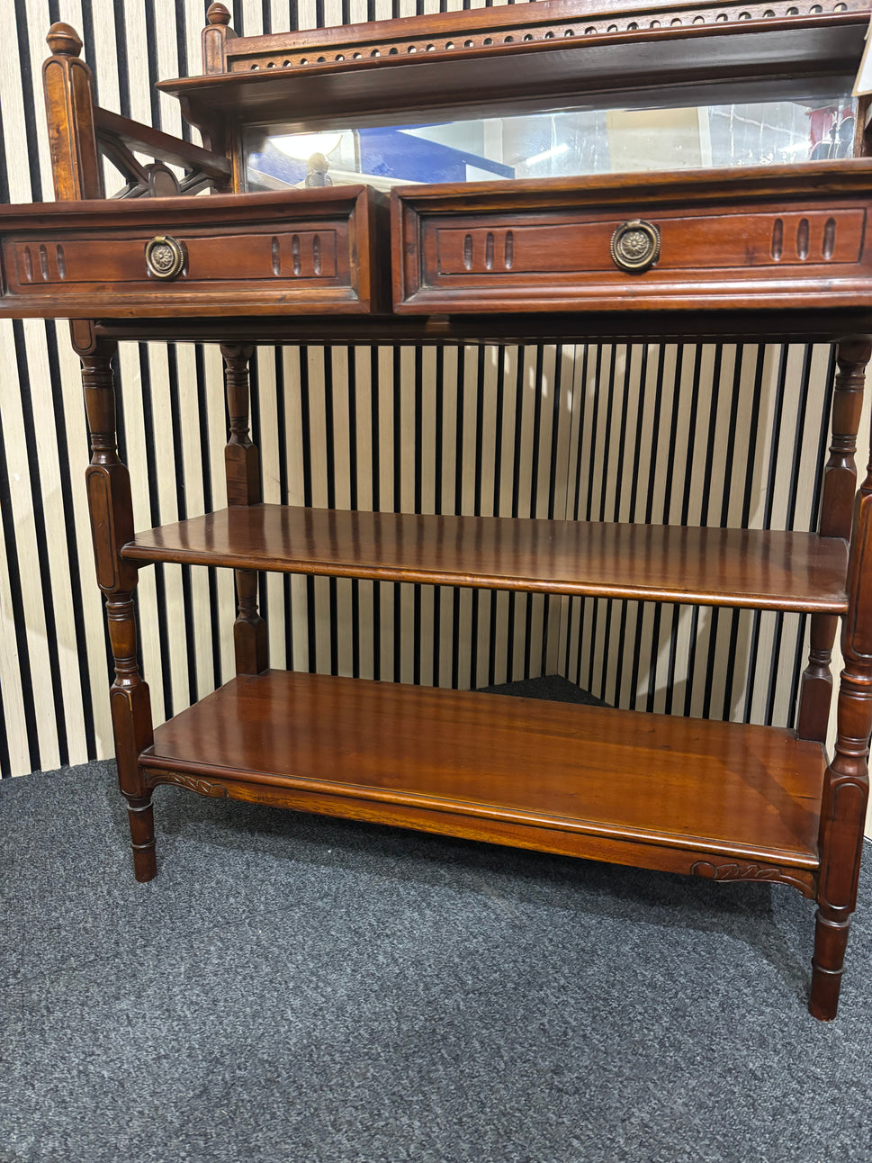 Ornate mahogany framed open bookcase with detailed carving and framed mirror back with 2 drawers (H 105 x W 80 x D 32 cm) 2325