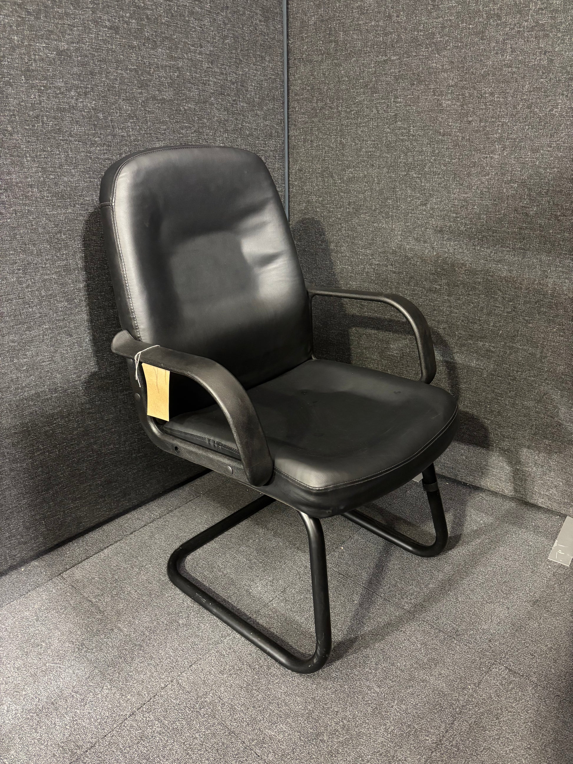 Black leatherette black metal framed meeting chair with fixed arms