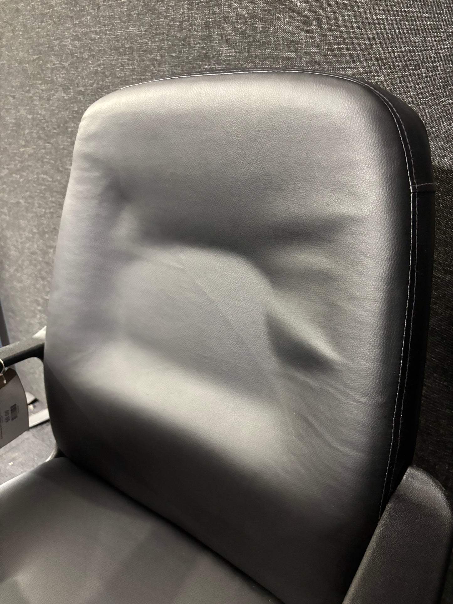 Black leatherette black metal framed meeting chair with fixed arms