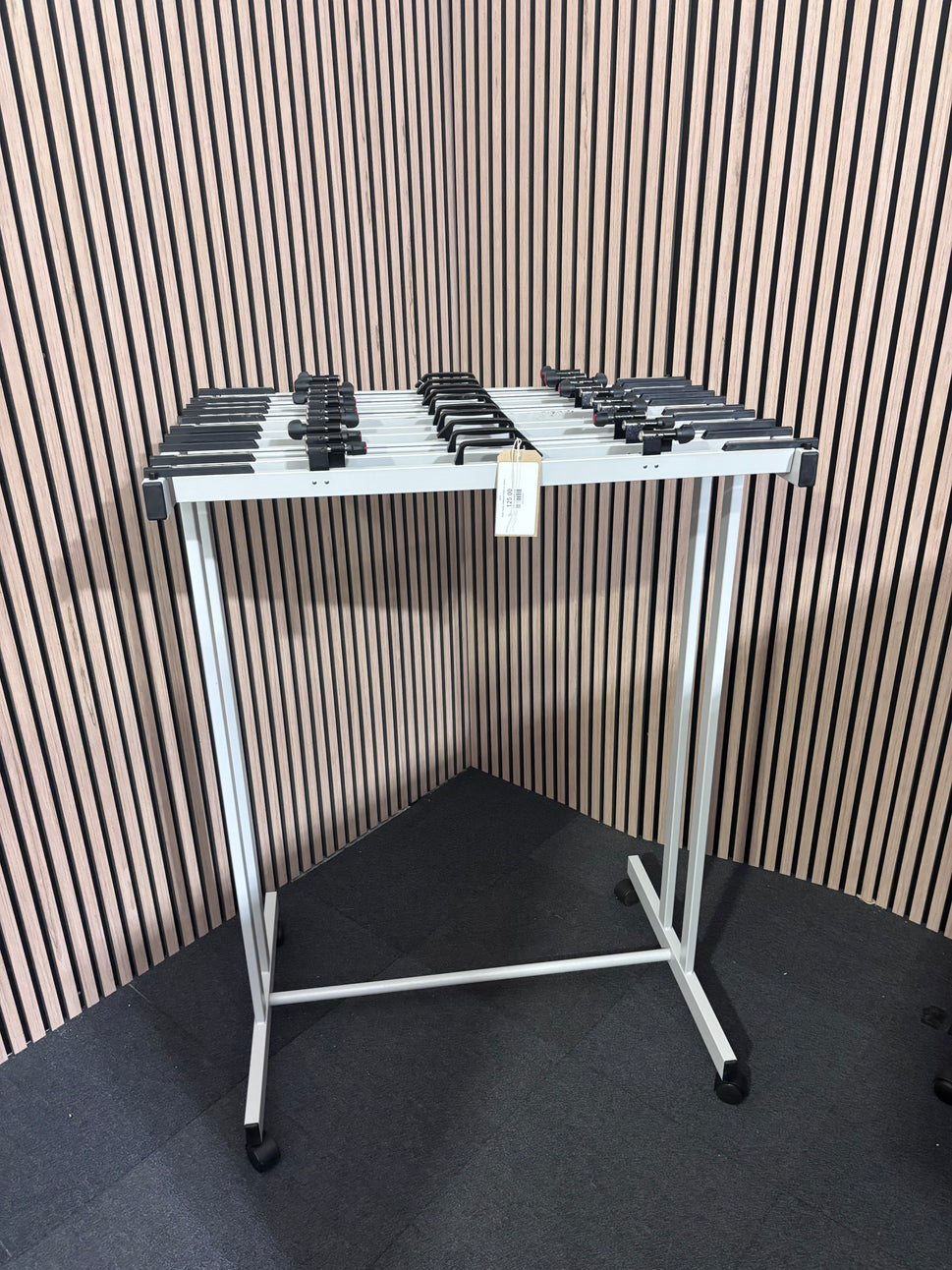 White mobile whiteboard holder on castors