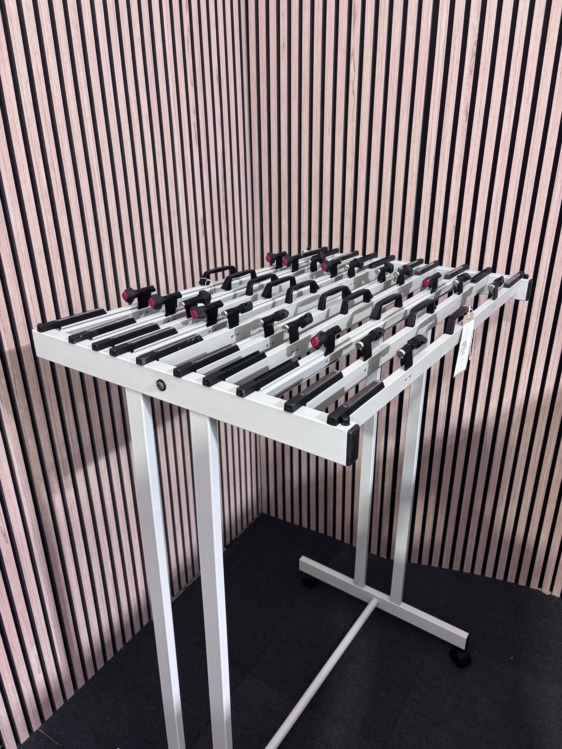 White mobile whiteboard holder on castors