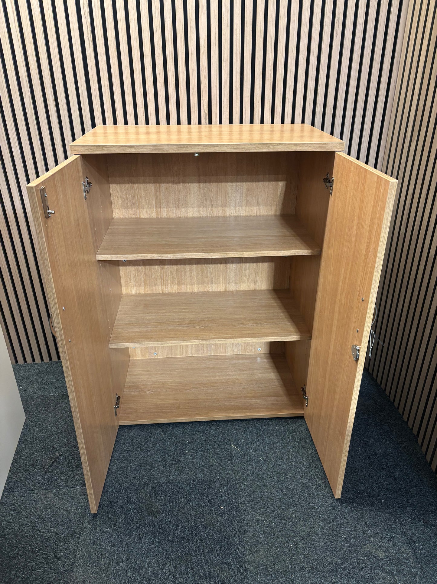 Universal 2 door storage unit in oak laminate with 2 no. internal shelves and key 1090Hx470Dx800W
