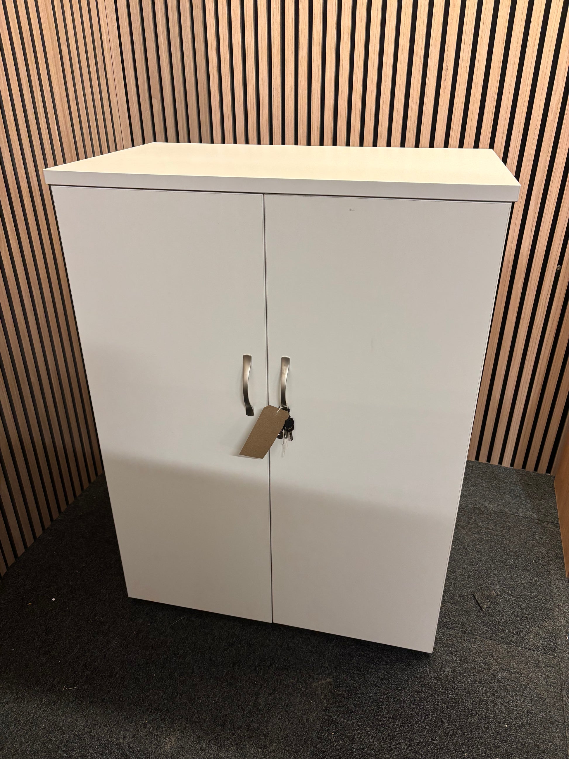 Universal 2 door storage unit in white laminate with 2 no. internal shelves and key 1090Hx470Dx800W