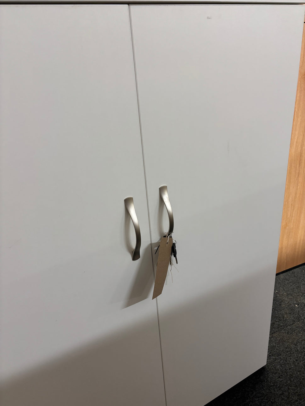 Universal 2 door storage unit in white laminate with 2 no. internal shelves and key 1090Hx470Dx800W