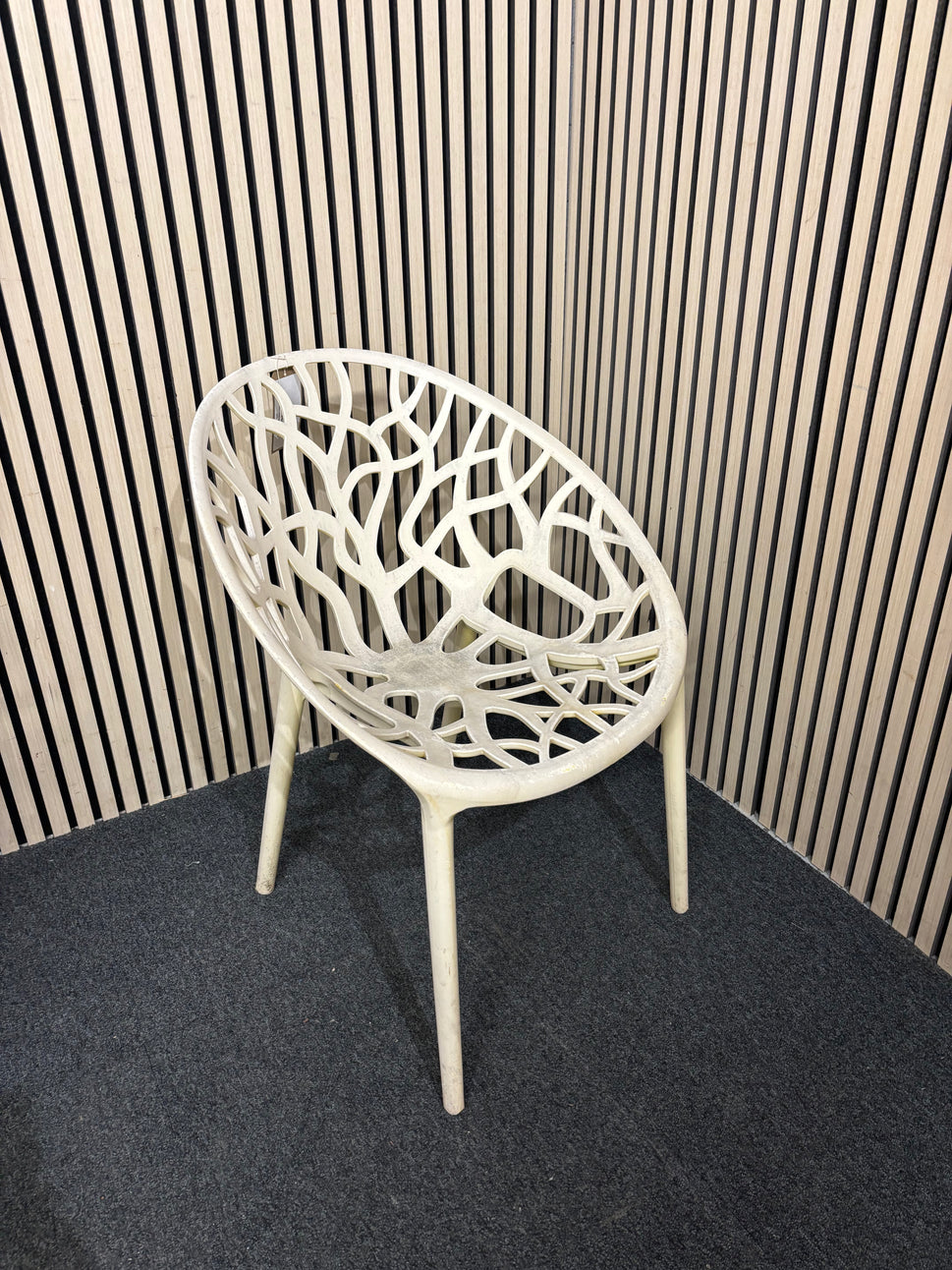 white stackable plastic outdoor chair - sun faded 3126
