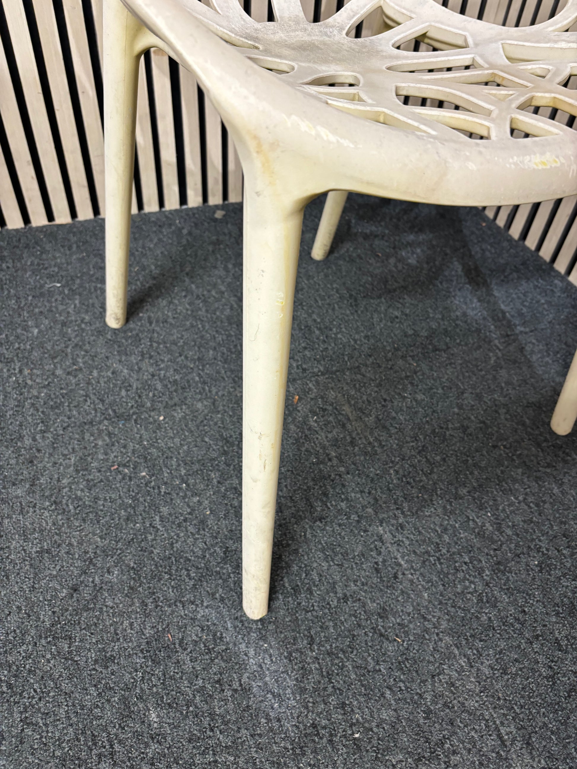 white stackable plastic outdoor chair - sun faded 3126