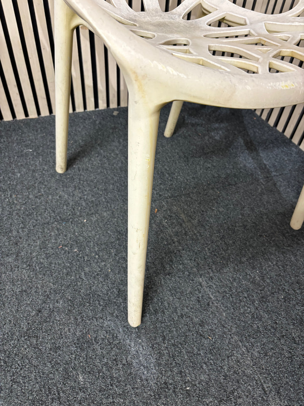 white stackable plastic outdoor chair - sun faded 3126