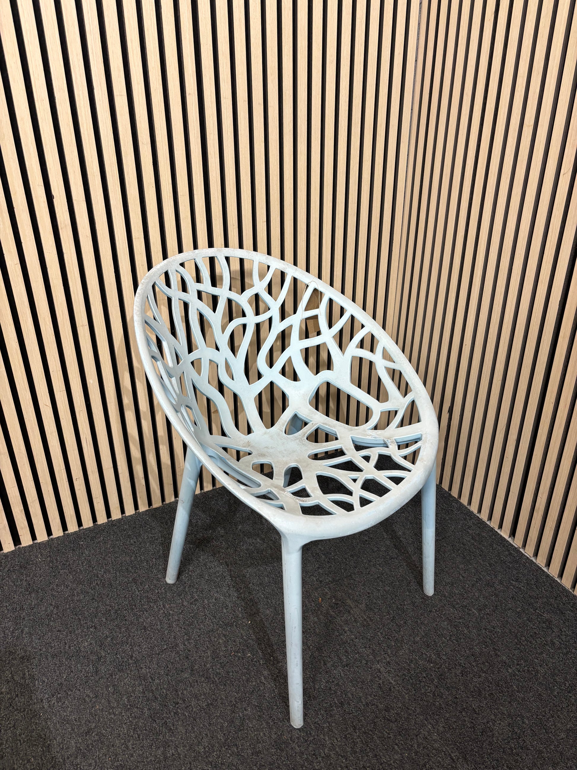 Light blue stackable plastic outdoor chair - sun faded 3126