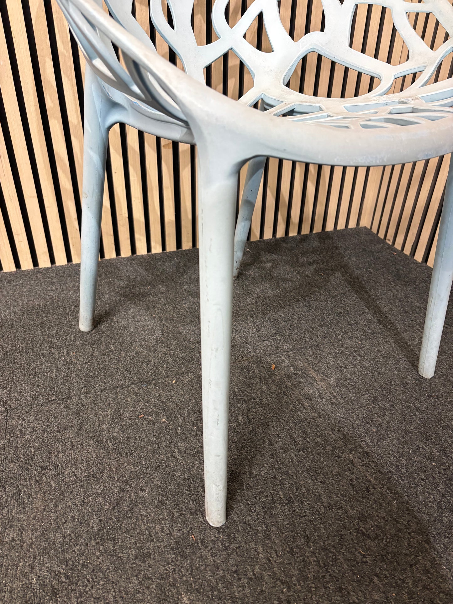 Light blue stackable plastic outdoor chair - sun faded 3126