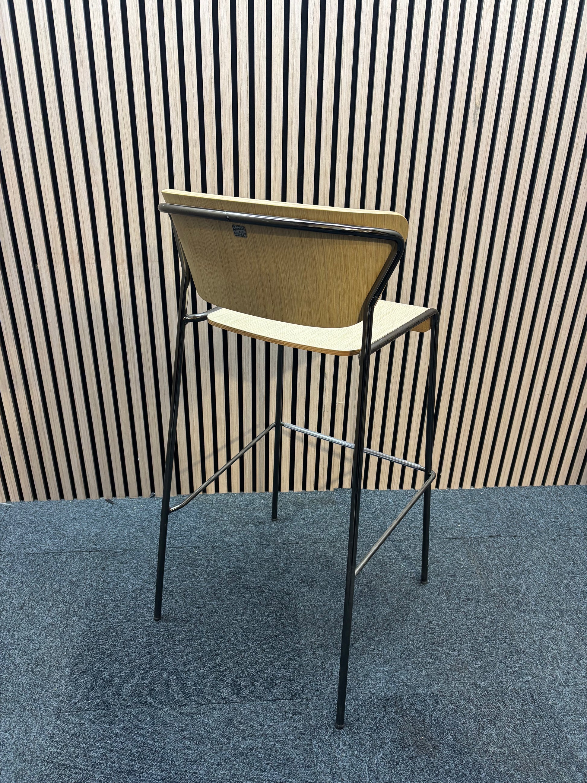 Salo bar stool with natural oak and solid 4 legged black frame